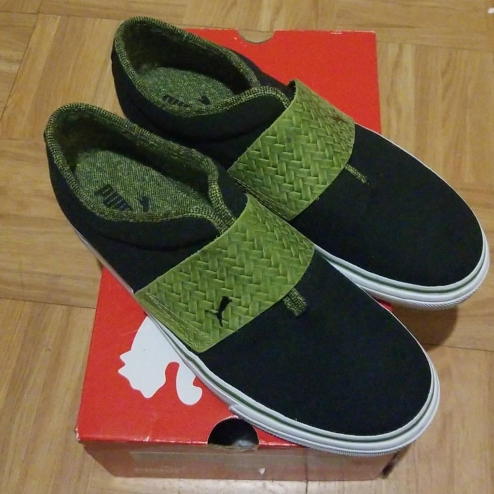 Puma black turtle green shoes.